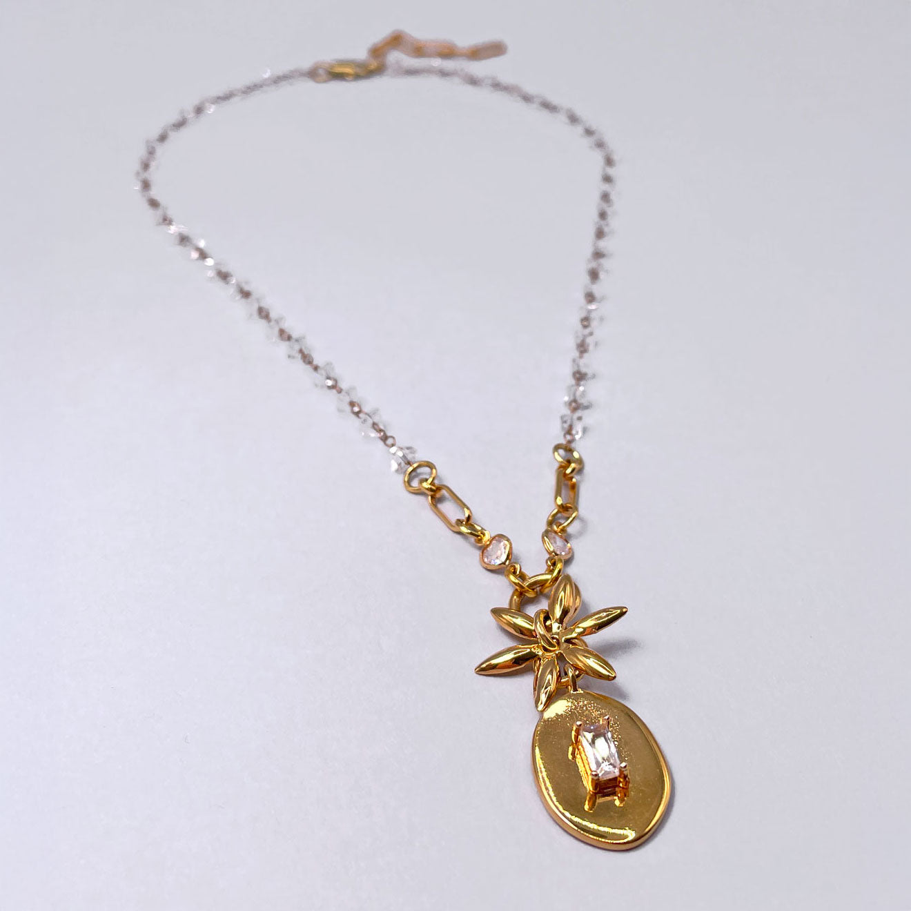 Necklace with Oval Pendant and Flower