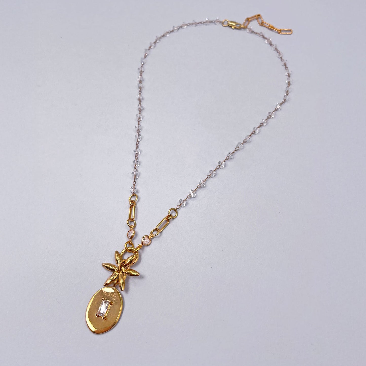 Necklace with Oval Pendant and Flower